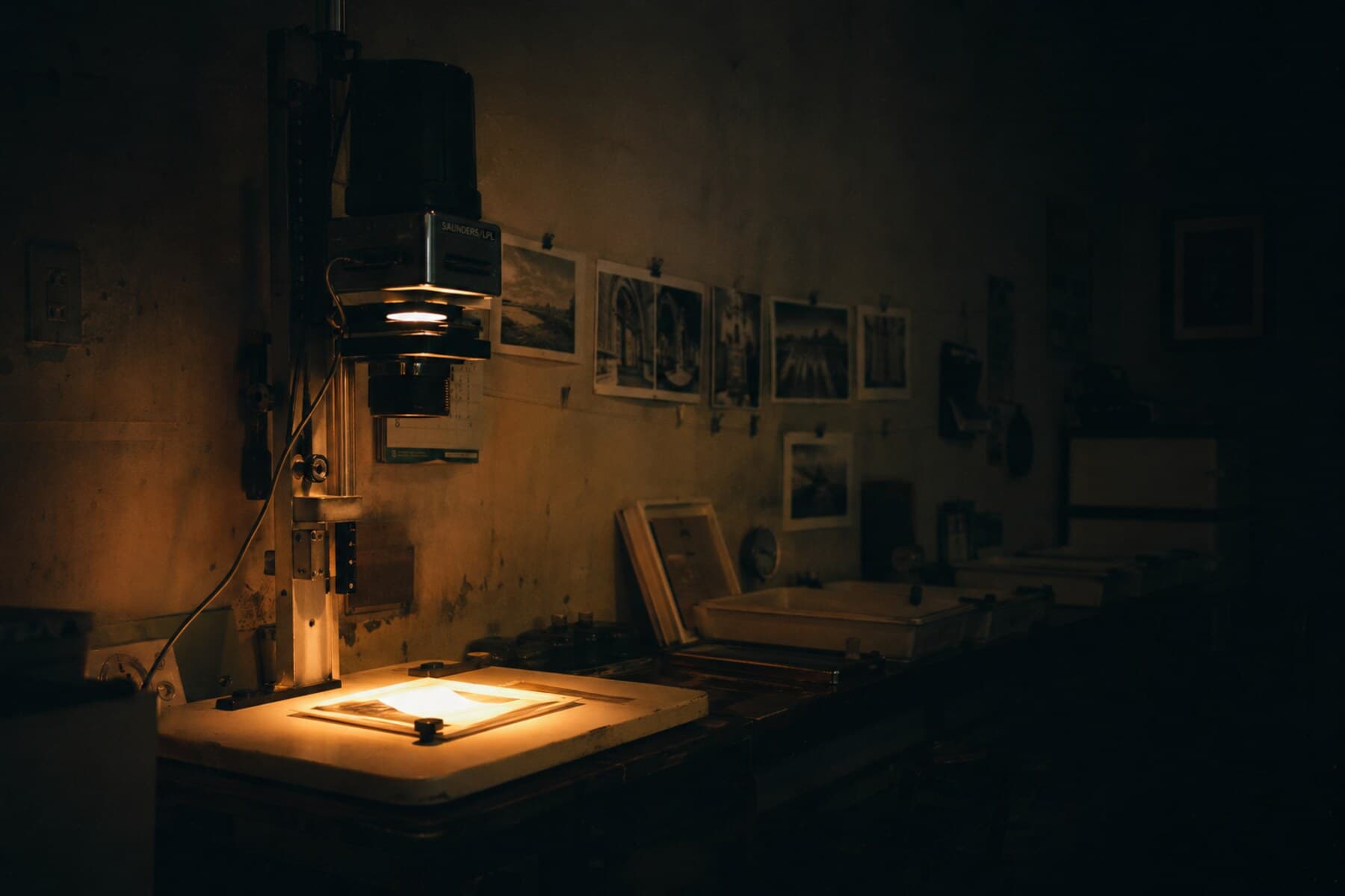 Darkroom workspace with trays and print handling tools